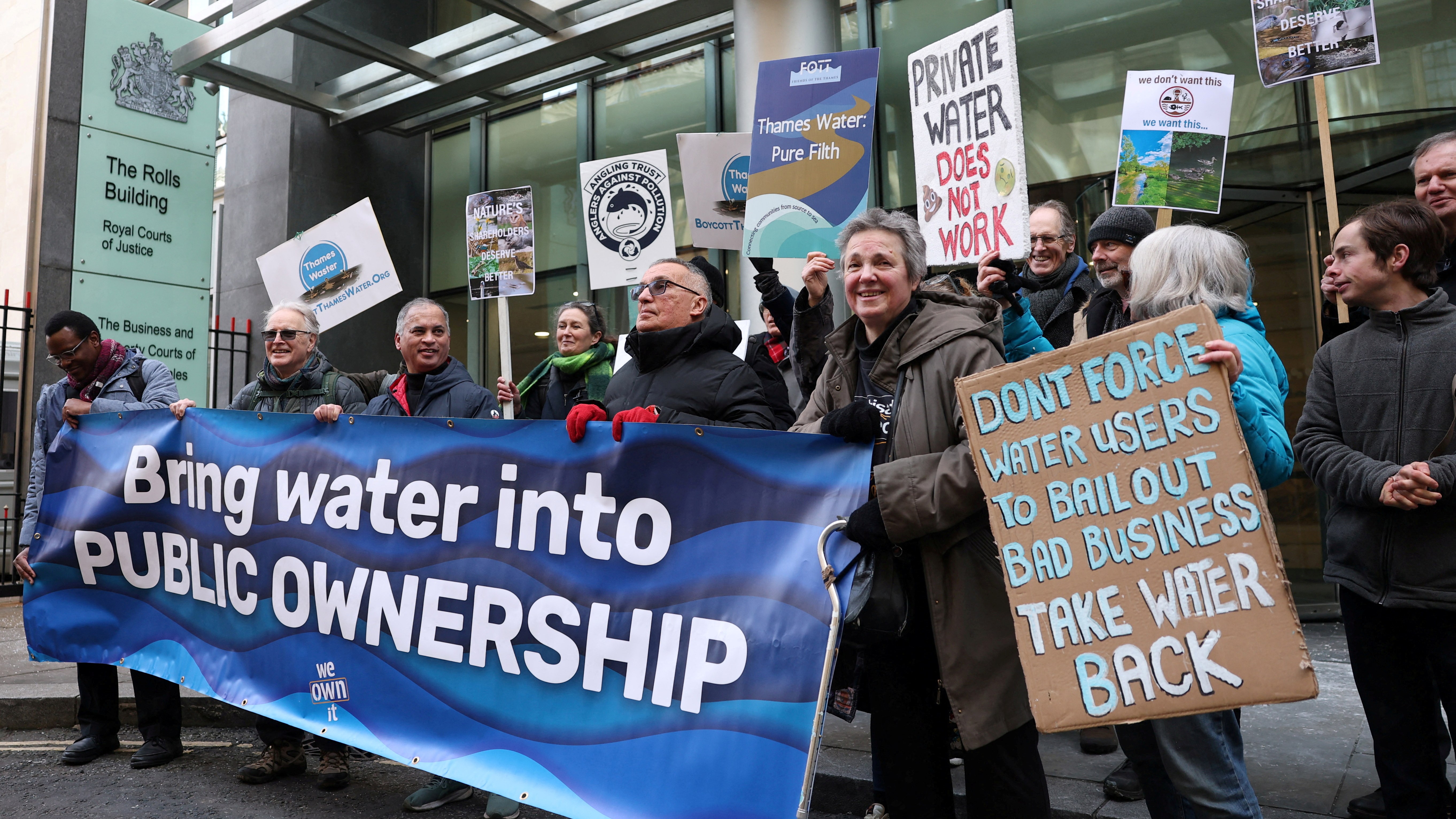 Protestors demonstrate against Thames Water's debt restructuring plan outside the High Court in London.